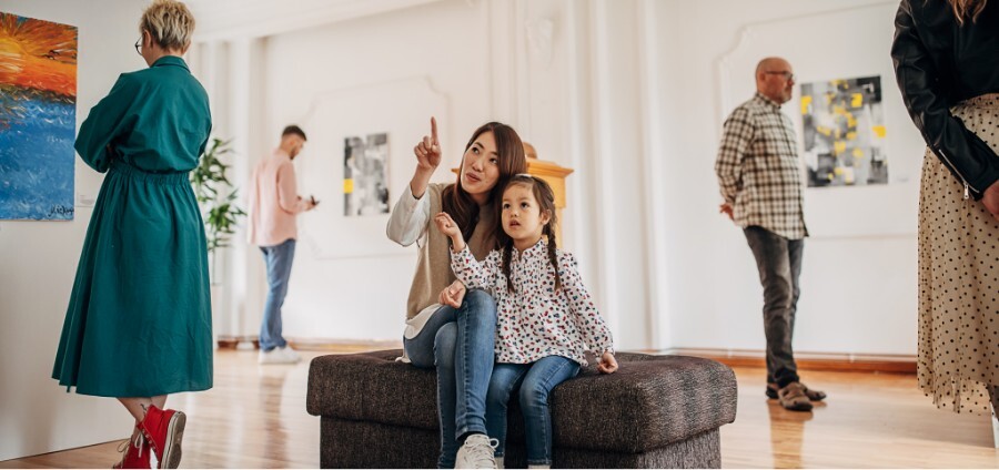 Mother and daughter visiting an art museum