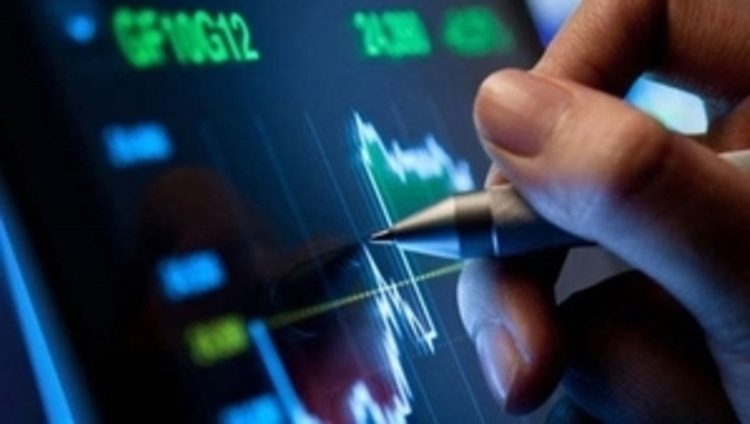 touch pen tapping a display showing graph data.