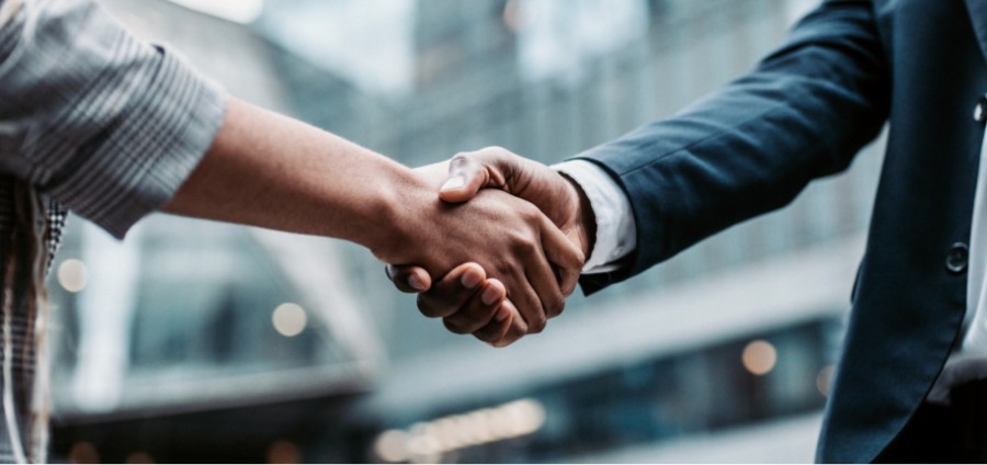 Two business executives shaking hands